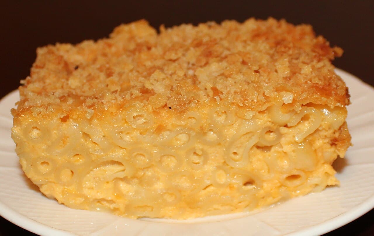 Baked macaroni cheese with a golden breadcrumb crust