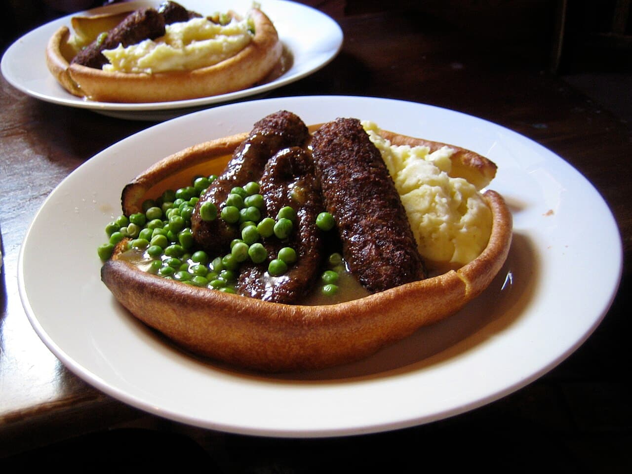 Sausages on mashed potato with onion gravy